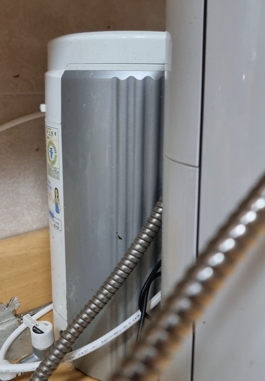 A photo showing two Pi-water purifiers installed side-by-side in a kitchen setting.