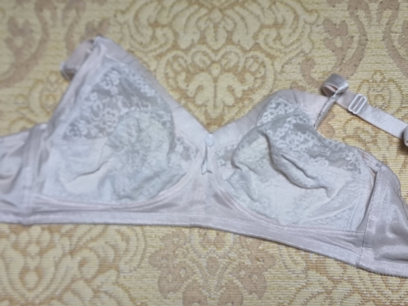 A gallery of five worn-out but intact women's bras, showcasing over two decades of durability from a single Korean brand.
