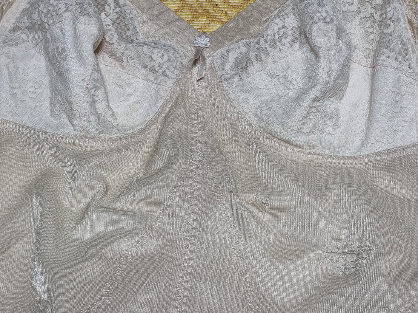 A gallery of four photos showing different angles of the same worn, 15-year-old all-in-one shapewear made in Korea.